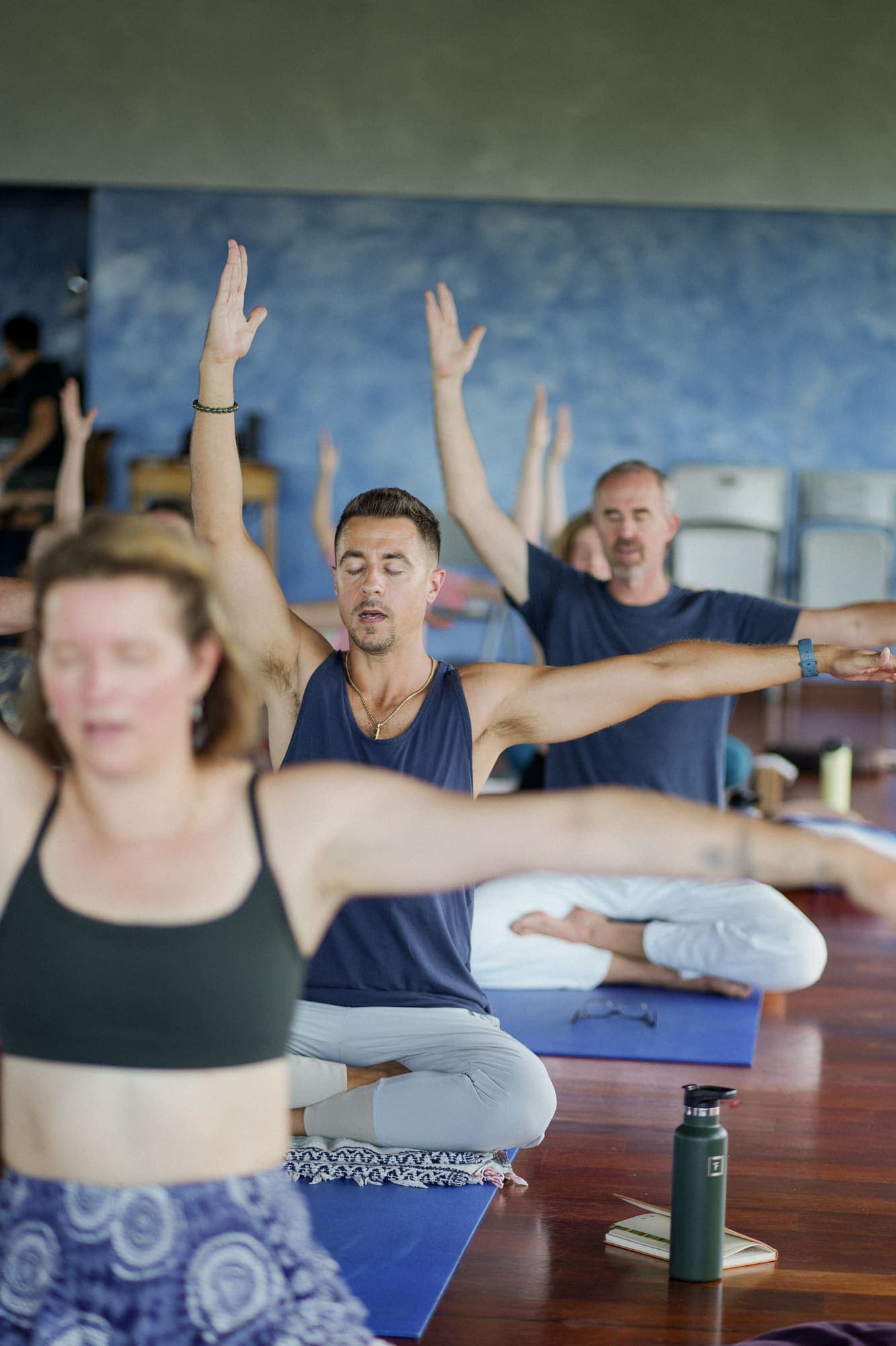 A group practicing together, arms raised in unison